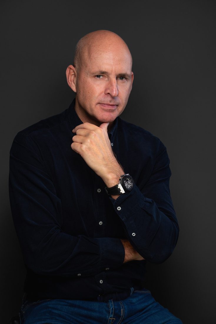 Nick Jeffries, founder of NU Projects, in a dark shirt against a plain dark ground
